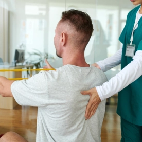 physiotherapist-working-with-patient.webp